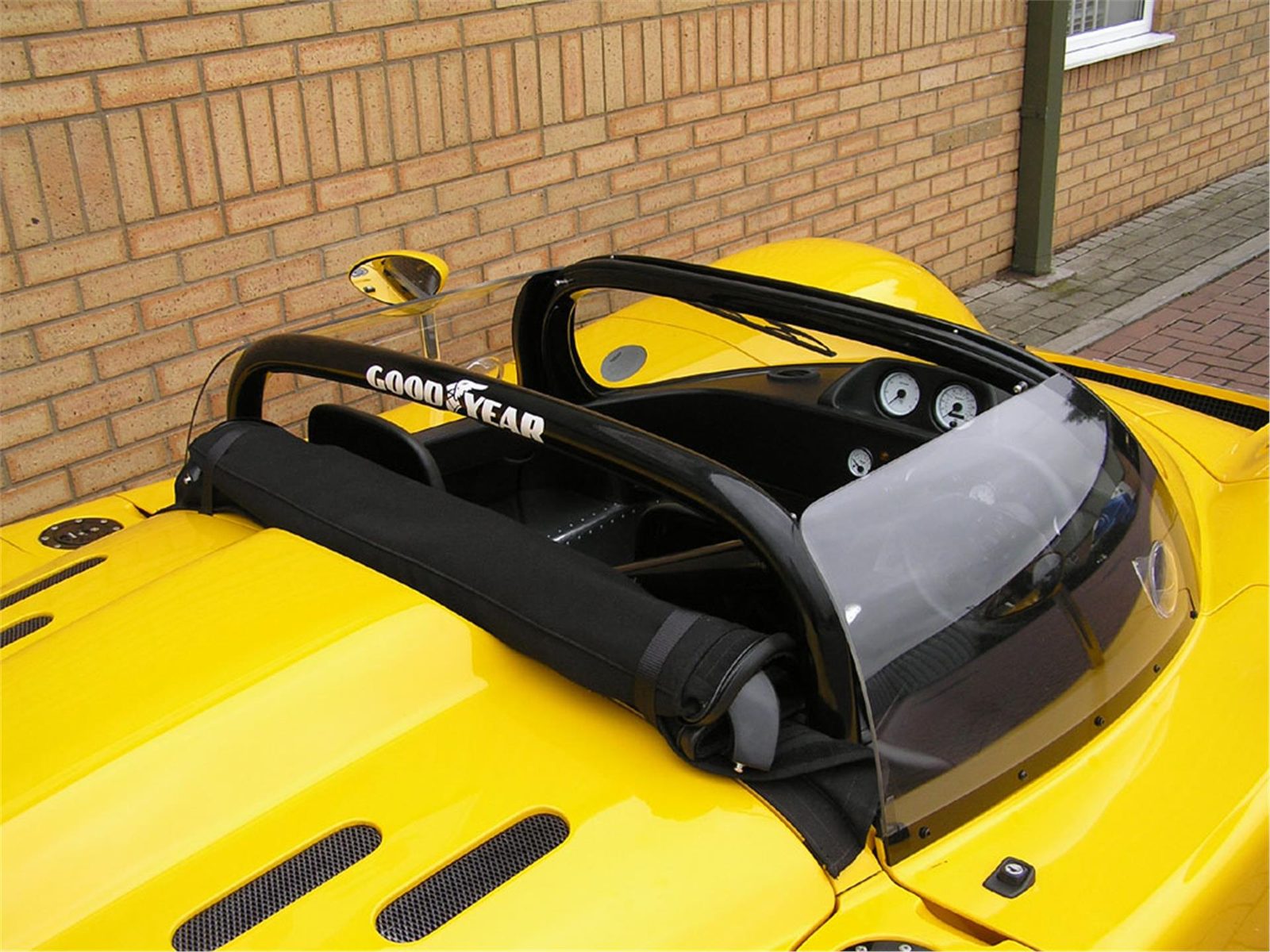 Cockpit of a yellow Ultima Can-Am seen from above