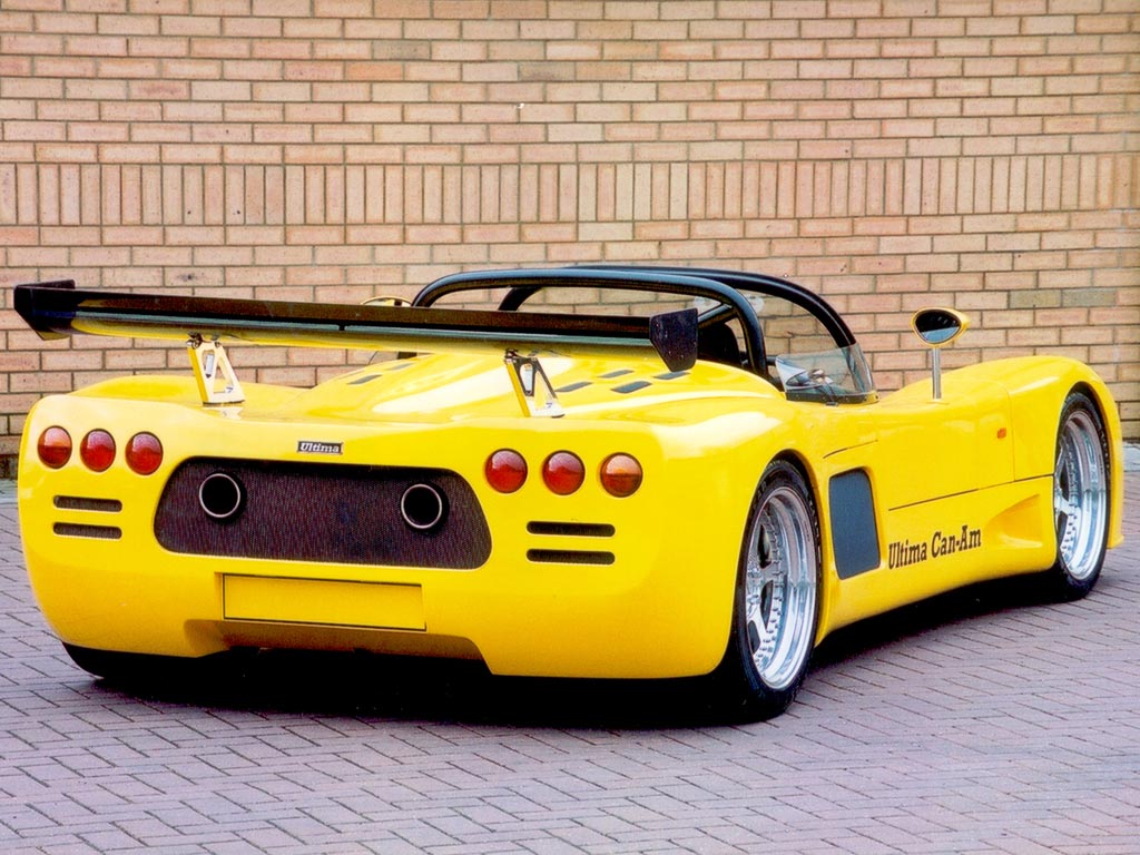 A yellow Ultima Can-Am photographed from the rear three-quarter angle