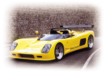 A yellow Ultima Can-Am photographed outside