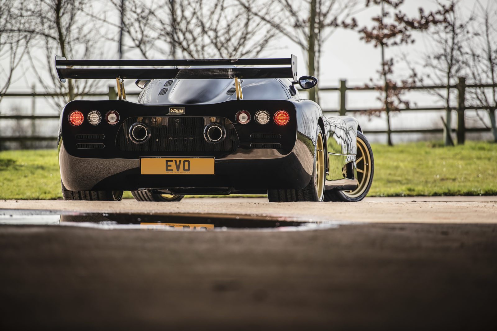 Black Ultima Evolution Coupe photographed from the rear