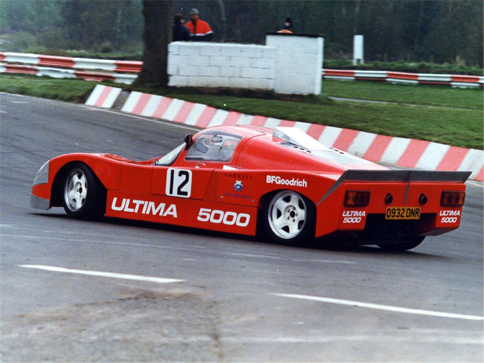Red early Ultima seen from the rear side at a circuit