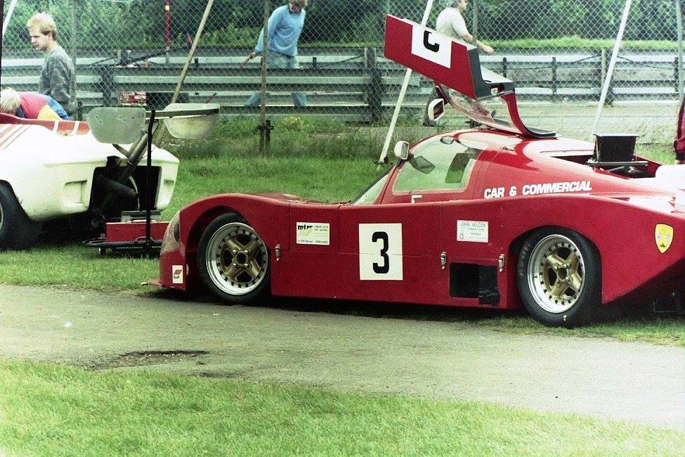 A red Ultima Mk2B photographed at a race circuit