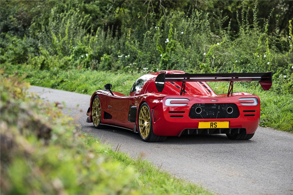 Red Ultima RS photographed on a country road