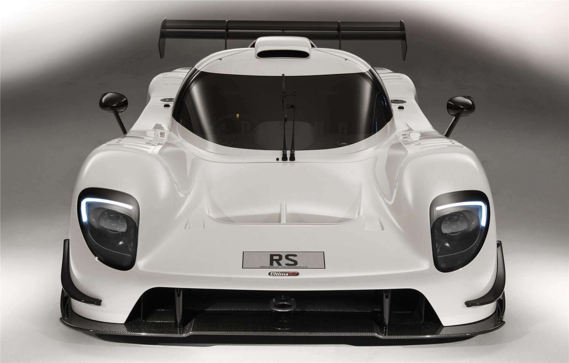 A white Ultima RS photographed from the front in an official studio image