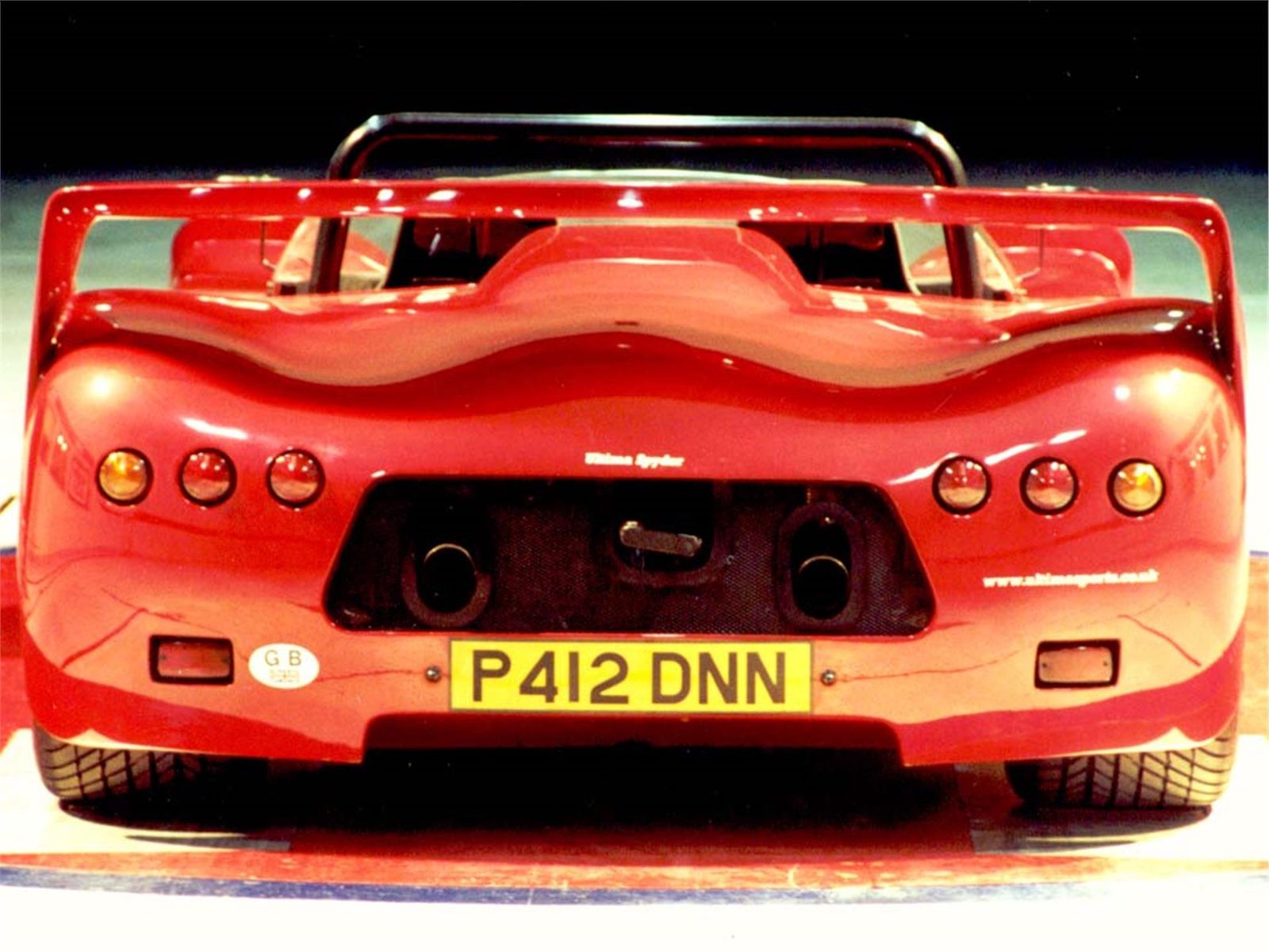 Rear view of a red Ultima Spyder