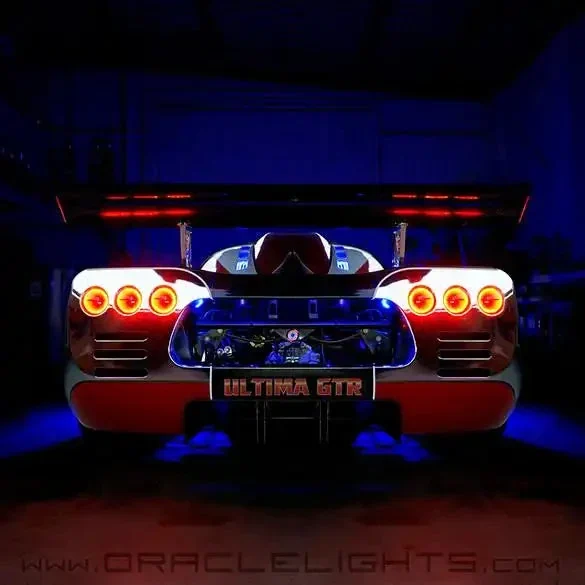 Rear view of an Ultima GTR with the circular tail-light halos illuminated.