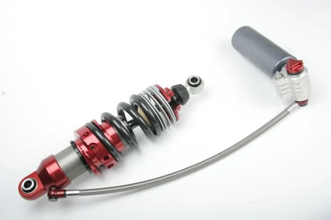 Intrax four-way coilover with its hose-connected remote reservoir.