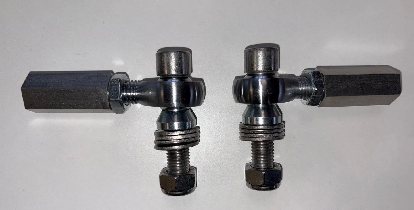 Pair of bump-steer adjusters shown side by side