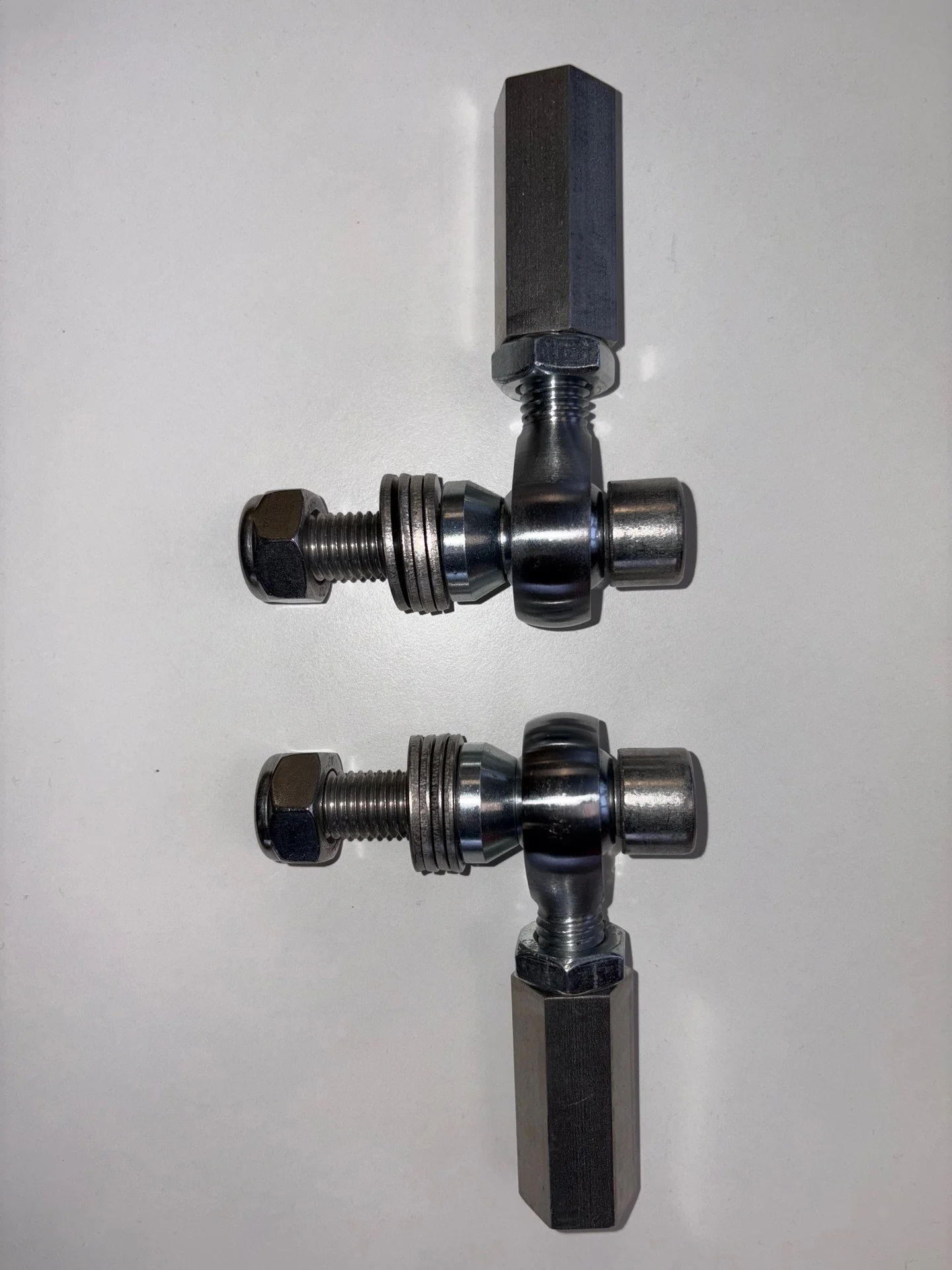 Pair of bump-steer adjusters arranged vertically