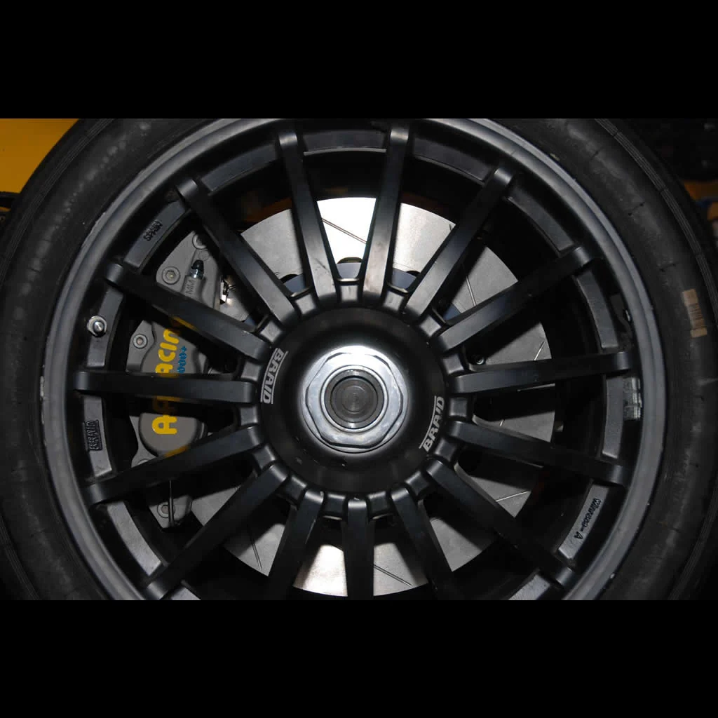AP Racing caliper visible through a black multi-spoke wheel