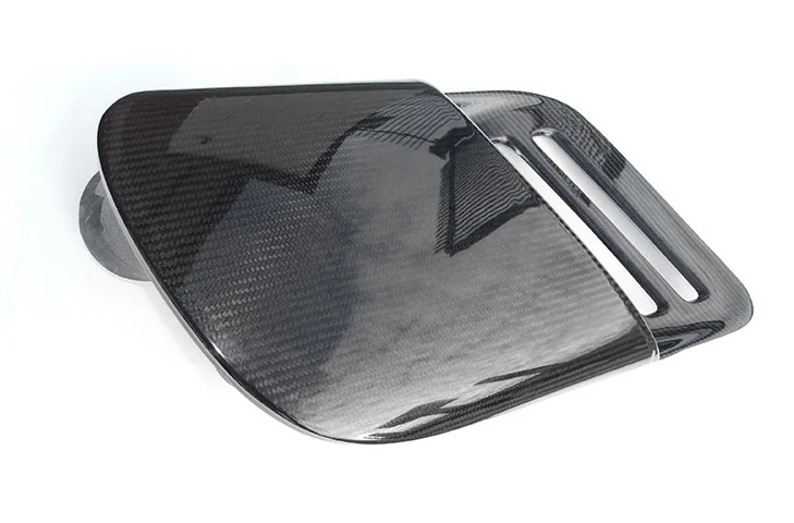Driver-side carbon-fibre intake duct viewed from above at an angle.