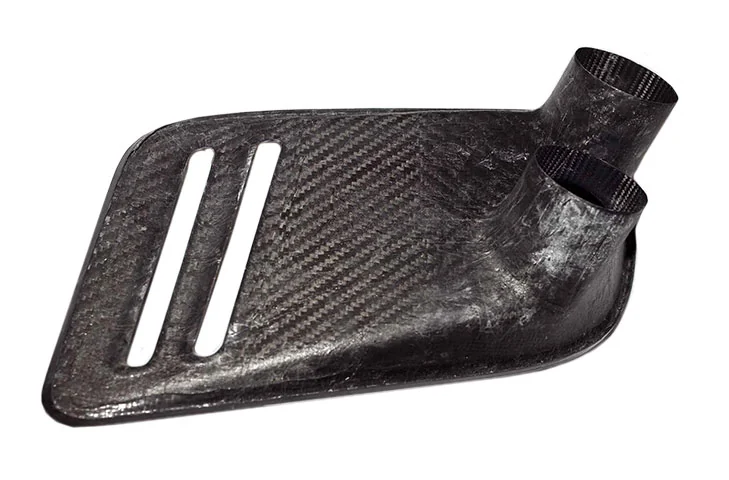 Rear of the driver-side carbon intake, showing the moulded duct outlet.
