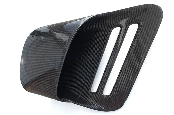 Passenger-side carbon-fibre intake duct viewed into the inlet opening.